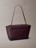 Red Defined by elegant, contemporary design, this collection features softly padded faux leather in elevated silhouettes. Finished with shiny Calvin Klein emblem hardware for a signature look  Women
