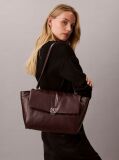 Red Defined by elegant, contemporary design, this collection features softly padded faux leather in elevated silhouettes. Finished with shiny Calvin Klein emblem hardware for a signature look  Women