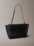 Black Defined by elegant, contemporary design, this collection features softly padded faux leather in elevated silhouettes. Finished with shiny Calvin Klein emblem hardware for a signature look  Women