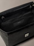 Black Defined by elegant, contemporary design, this collection features softly padded faux leather in elevated silhouettes. Finished with shiny Calvin Klein emblem hardware for a signature look  Women