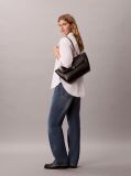 Black Defined by elegant, contemporary design, this collection features softly padded faux leather in elevated silhouettes. Finished with shiny Calvin Klein emblem hardware for a signature look  Women