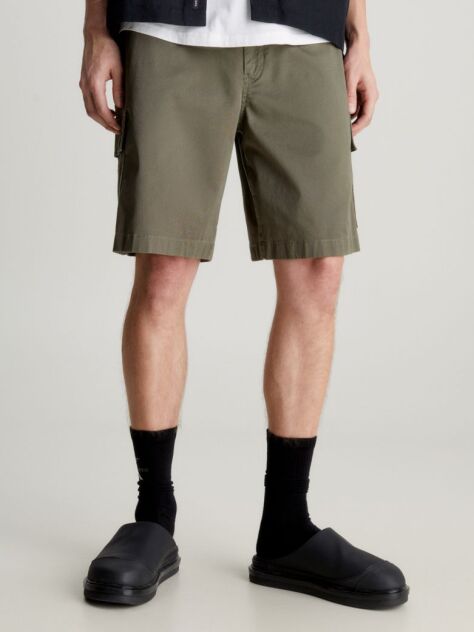Green Calvin Klein Essentials. Timeless staples perfected for the modern wardrobe, evolving every season with new shapes and colours. These shorts are created with 20% recycled cotton, created by reprocessing existing materials.  Men