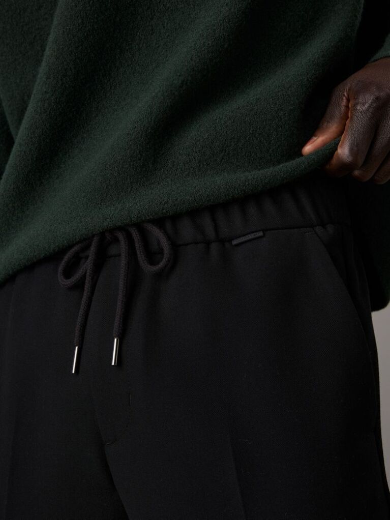 Black Tapered Pleated Knit Trousers  Men
