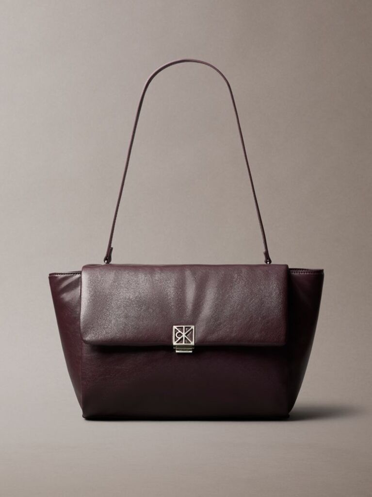 Red Defined by elegant, contemporary design, this collection features softly padded faux leather in elevated silhouettes. Finished with shiny Calvin Klein emblem hardware for a signature look  Women